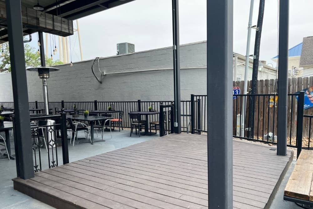 An outdoor stage platform hosts live performers at Katy Crossing Icehouse every weekend, owner Bill Fanning said. (Asia Armour/Community Impact)