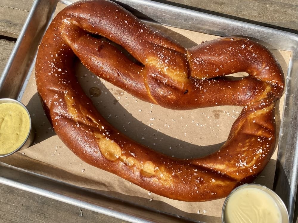 The Crown Pretzel ($11.25) is served hot with homemade beer cheese and stone ground mustard. (Cassandra Jenkins/Community Impact)