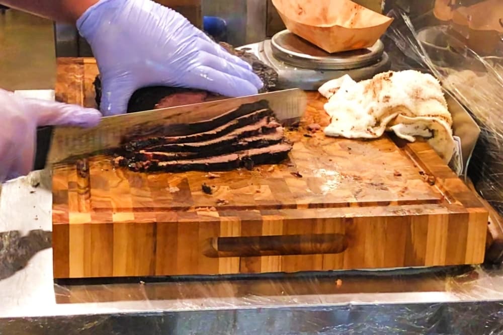 Brisket Rules Slider Bar offering barbecue options inside Grapevine's Harvest Hall