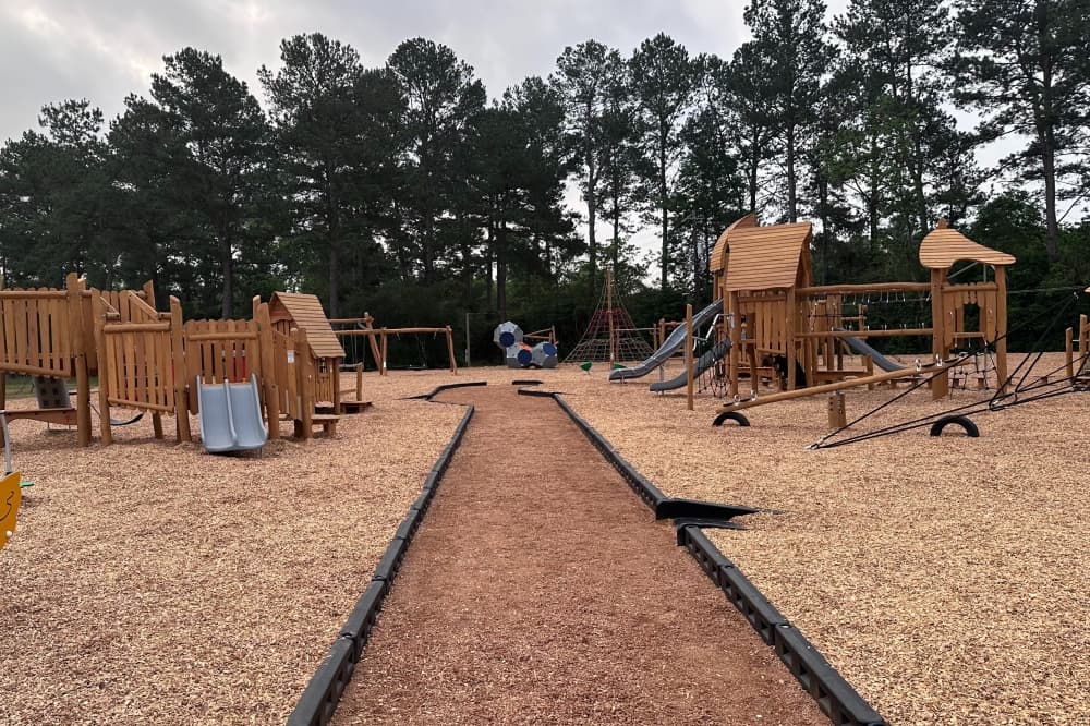 The center of the playground at Matheson Park, with two play structures. 