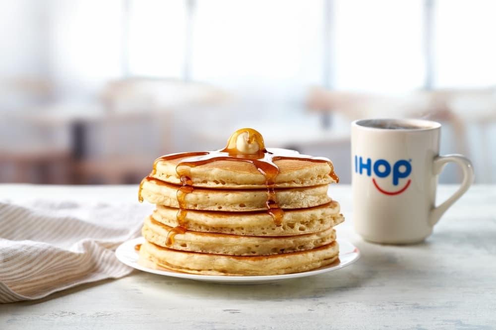 stack of pancakes and a coffee mug