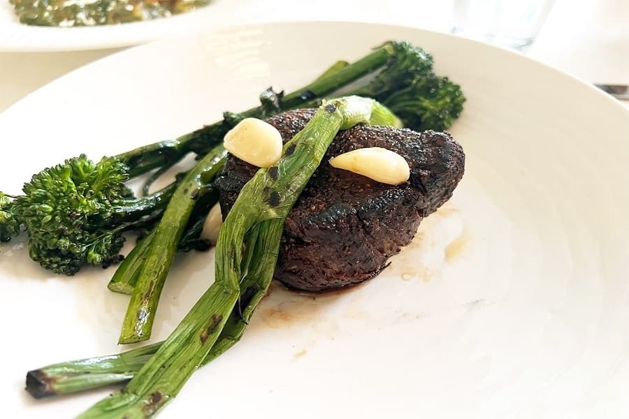 filet mignon topped with broccolini 