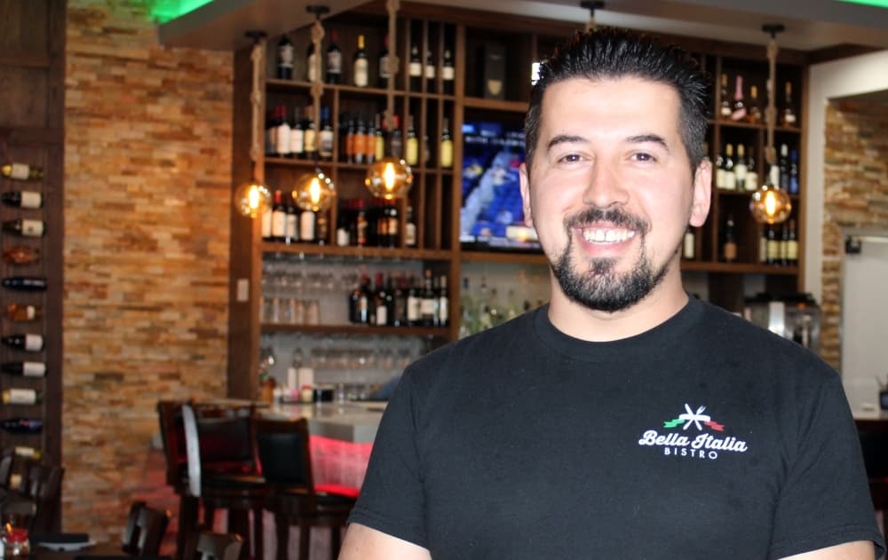 a man stands inside a restaurant