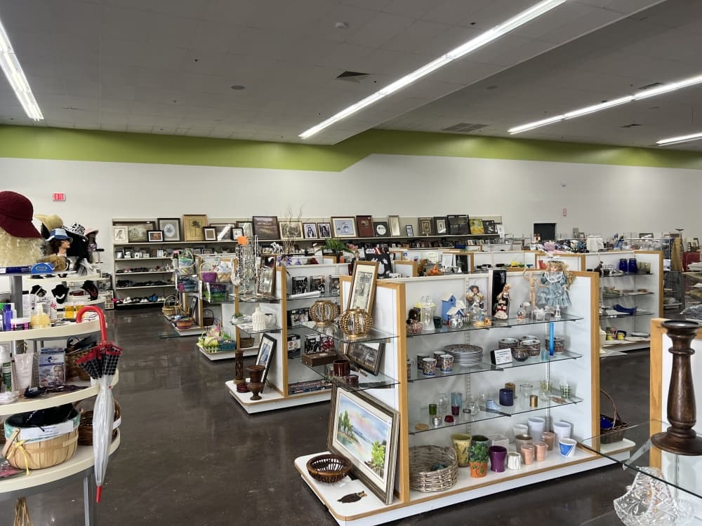 various home decor items on white shelves 