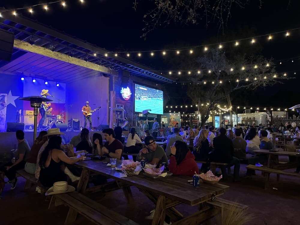People gathered March 4 at Armadillo Den to watch an Austin FC game, hear live music or enjoy a drink. Armadillo Den is one of several bars in the growing South Menchaca Road stretch. (Darcy Sprague/Community Impact)