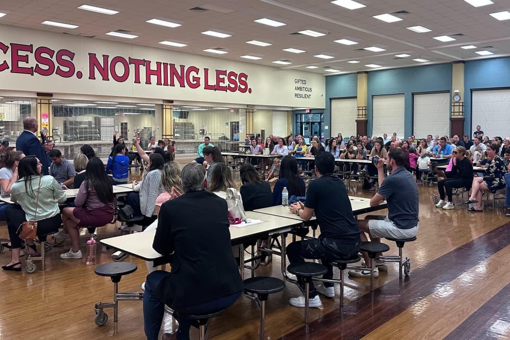 Tomball ISD Chief Operating Officer Steven Gutierrez addresses a room full of attendees. 