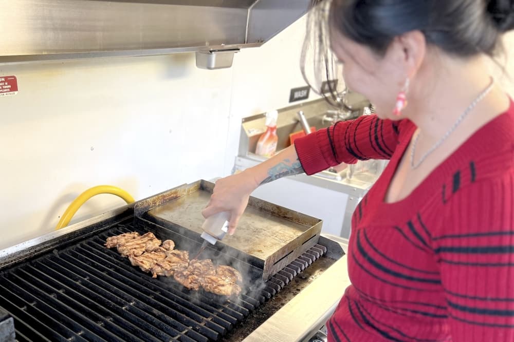 The food at Pacific Flame is cooked over lava rocks, which makes it more authentic. (Zacharia Washington/Community Impact)