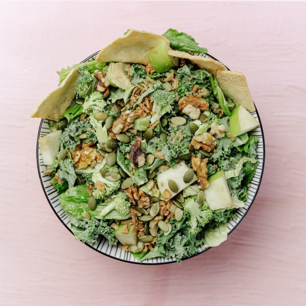 The Forest ($12.95) is quinoa, mixed greens, kale, broccoli, green apple, edamame, pepitas, fried onions, pita chips, walnuts and a green house dressing. (Courtesy Juicepop & More)