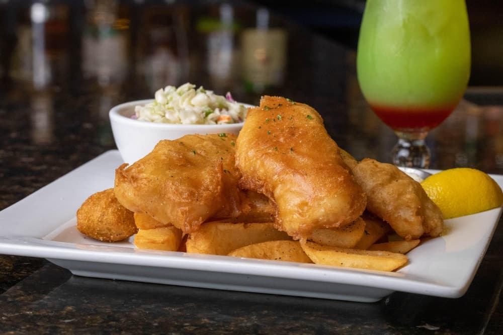 Image of fish and chips with a side of cole slaw