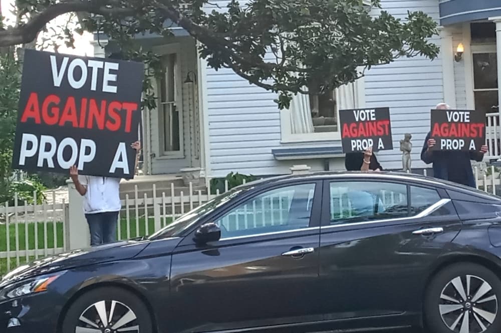 Opponents of Proposition A—who say it could increase crime—protest outside a March 16 campaign launch party in San Antonio. (Edmond Ortiz/Community Impact)