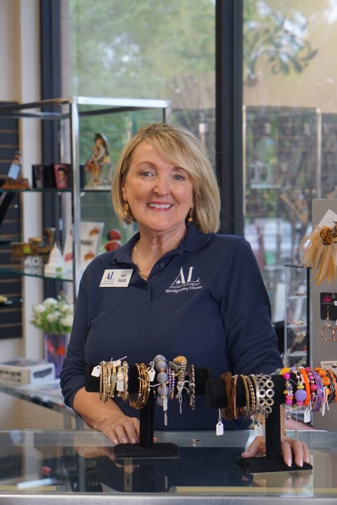 Volunteer Kay Raun mans the jewelry counter at the thrift shop. (Cassandra Jenkins/Community Impact)