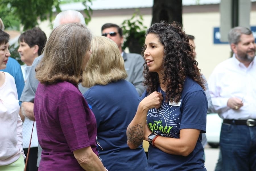 Volunteers in Medicine Nurse Andrea Feingold talks to a community member. 