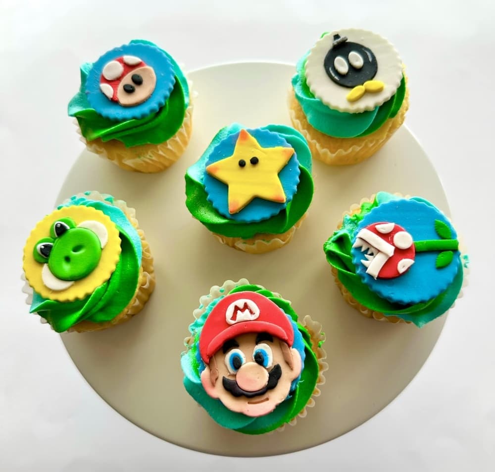 Six cupcakes with Super Mario Bros. characters
