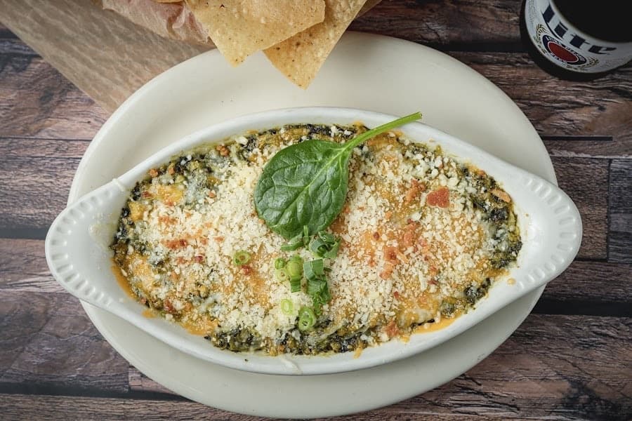 Spinach artichoke dip ($10.95) is served warm with tortilla chips. (Courtesy Andy's Bar & Grill) 