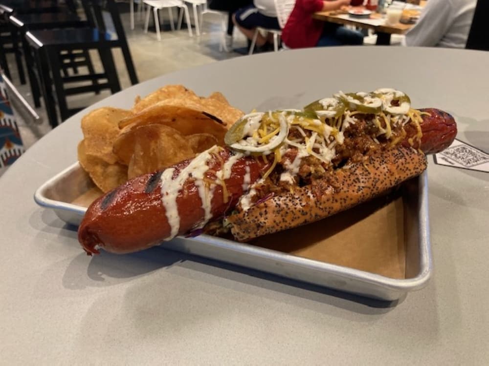 A chili dog with chips