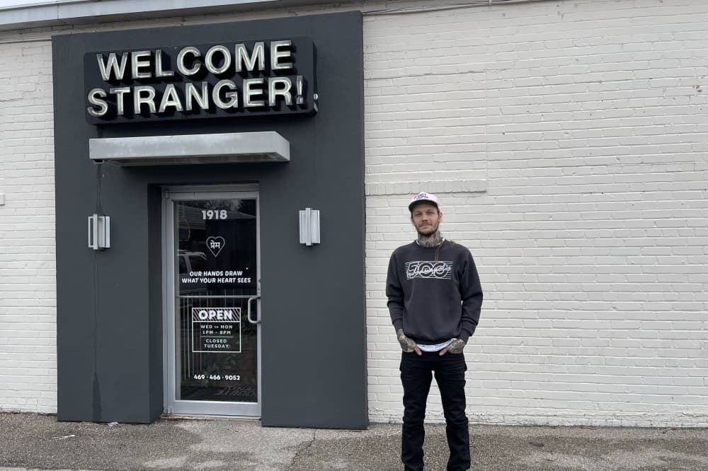 image of andy felty standing outside welcome stranger tattoo