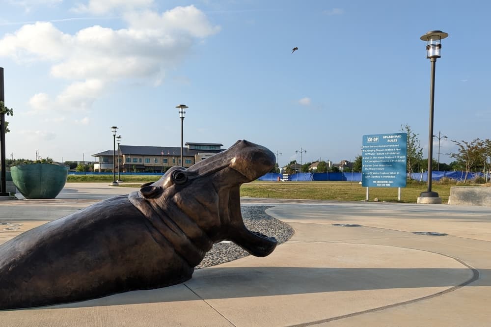 Revised development agreement for Hutto's Co-Op District mandates parking garages, stricter timelines