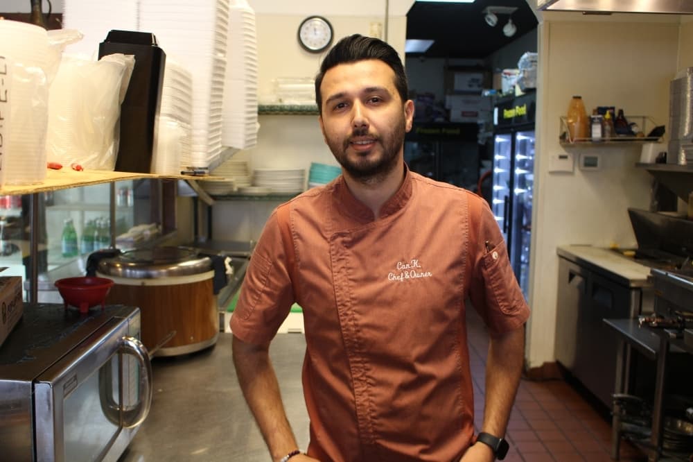 a chef standing inside a kitchen