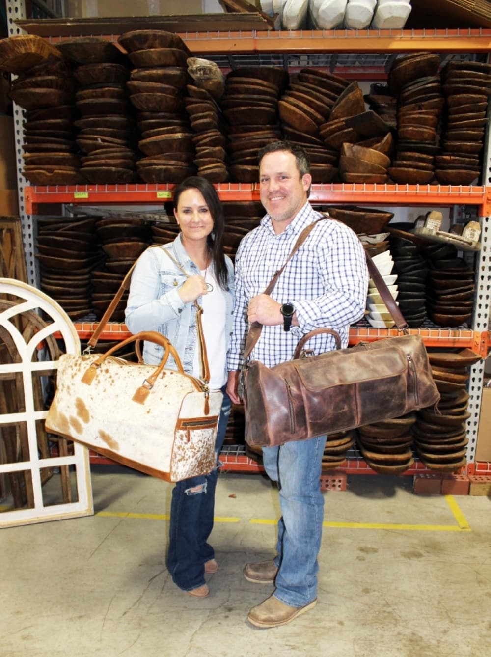 People holding leather bags inside a store