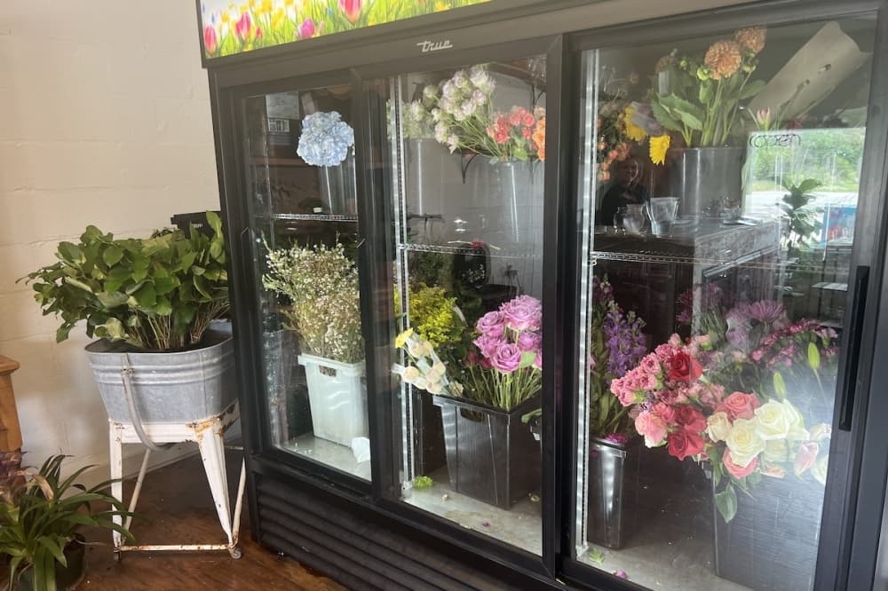 Flowers at Fletcher's are kept in a small cooler, which allows for the opportunity to rotate them often, keeping the selections more fresh. (Zacharia Washington/Community Impact)