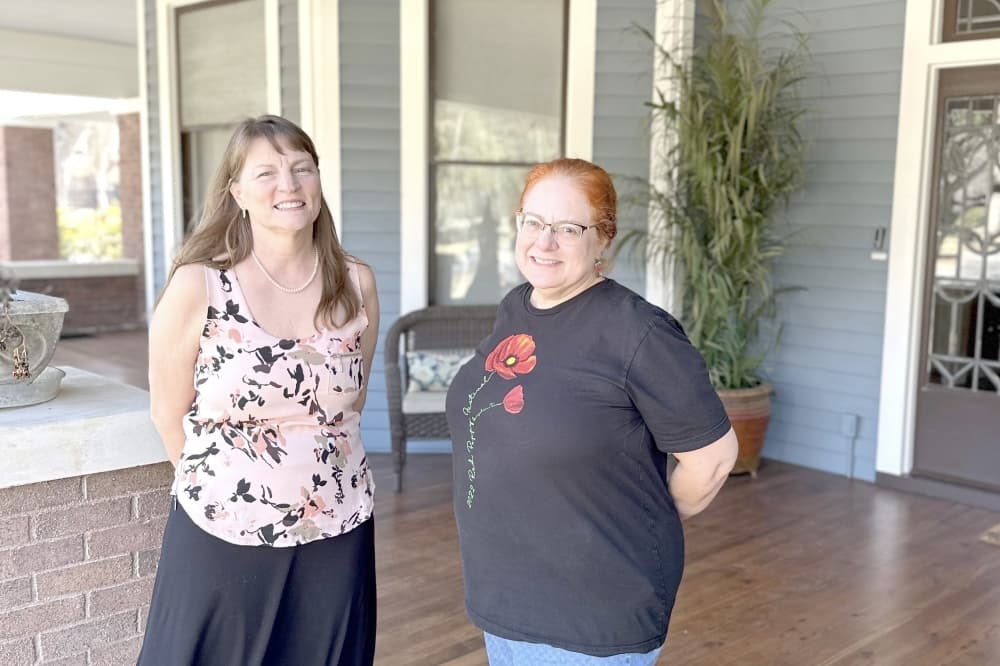 San Gabriel House Bed & Breakfast owner Jeannie Snead and innkeeper Danni Babik stand on the house's porch. 