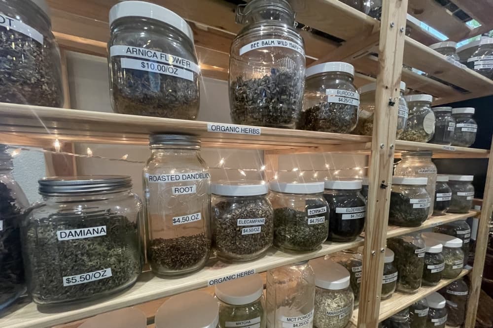 Shelves showing herbs and spices offered at Sanctuary Holistic Kitchen 