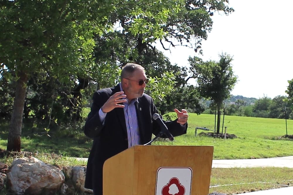 District 9 City Council Member John Courage speaks at the May 17 ribbon-cutting for Classen-Steubing Ranch Park at 20202 Hardy Oak Blvd. (Edmond Ortiz/Community Impact)