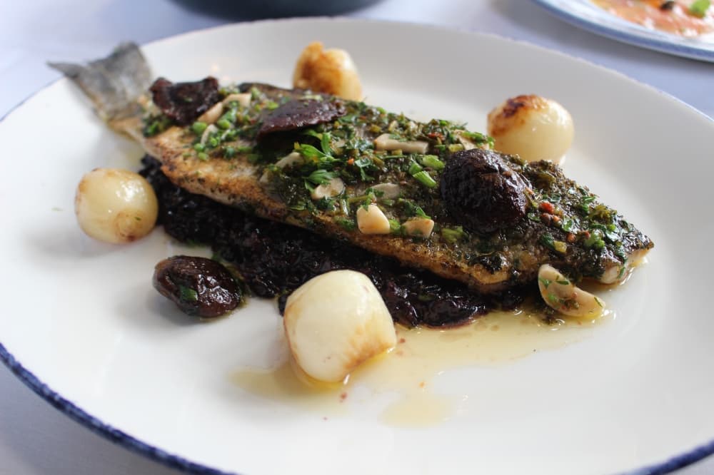 The Branzino bagna cauda($XX)  is a saltwater sea bass over piedmont black rice.