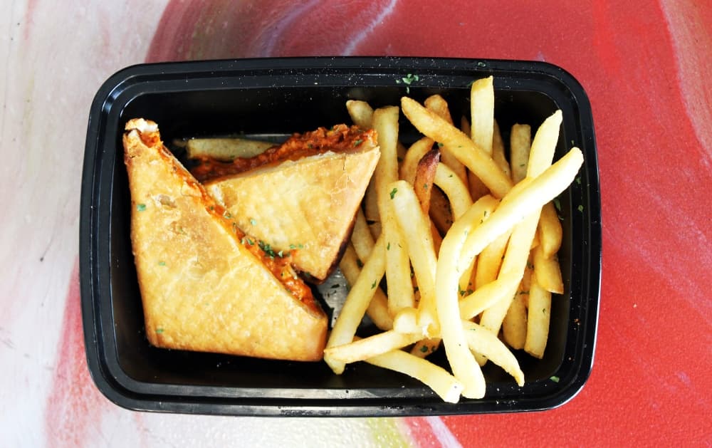 Pizza Puff with fries dish