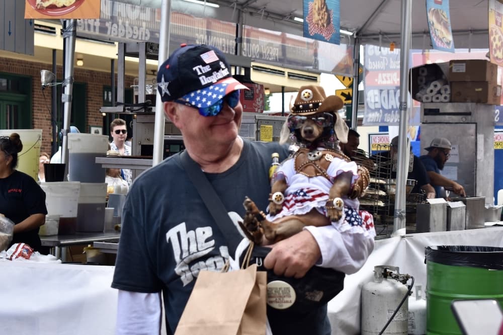 The Godfather brought his dressed-up dachshund dog to the festival. (Hannah Johnson/Community Impact)