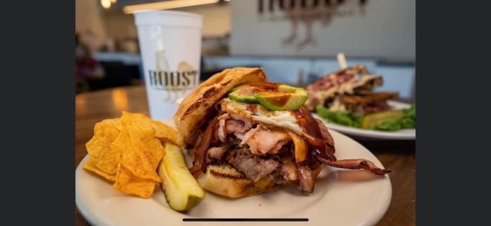 The Rooster sandwich ($14.99) comes with brisket, ham and avocado. (Courtesy Roost)