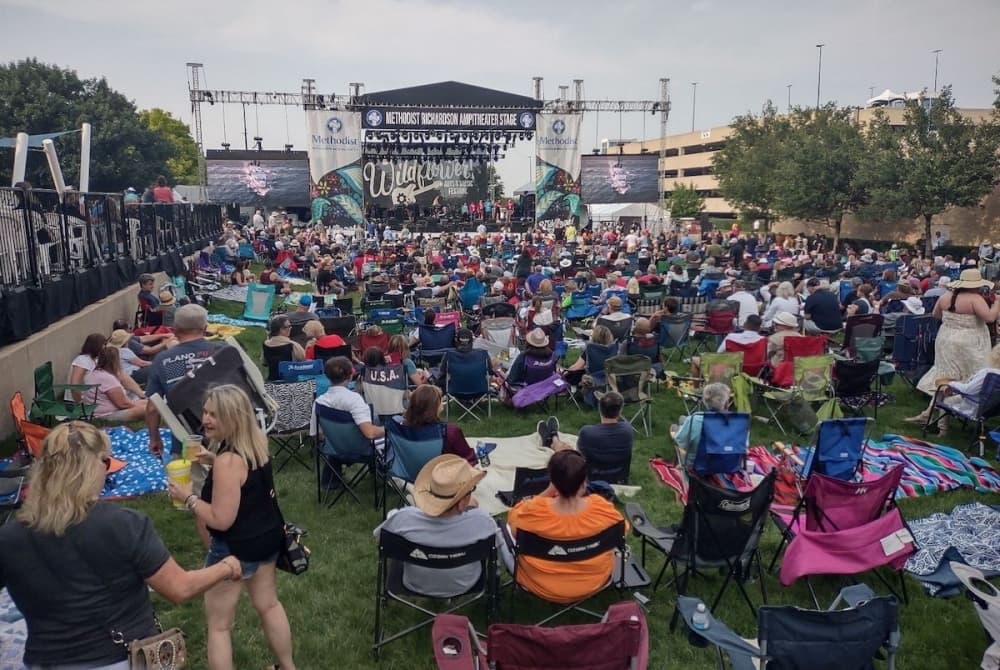 Residents sitting in front of the Methodist Richardson stage