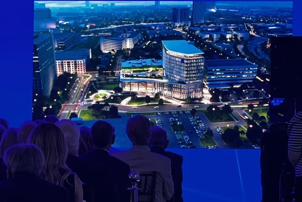 Guests in this photo are watching a video of Baylor's new Lillie and Roy Cullen Tower. 
