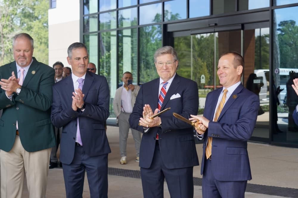 City of Conroe Mayor, Jody Czajkoski, far right, helps cut the ribbon with colleagues for the Hyatt Regency Conroe May 25. 