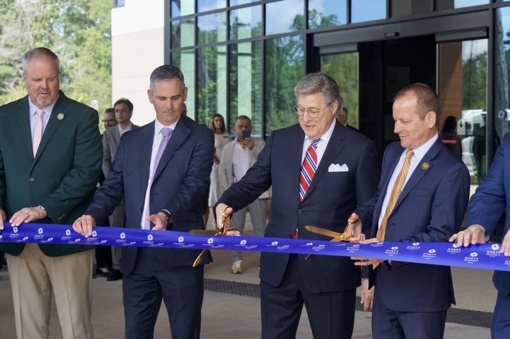 City of Conroe Mayor, Jody Czajkoski, far right, helps cut the ribbon with colleagues for the Hyatt Regency Conroe May 25. 