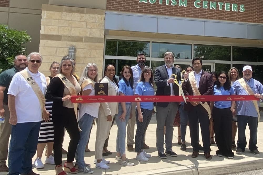 Staff at Apara Autism Center and representatives of the San Antonio Chamber of Commerce formally mark the opening of Apara’s first San Antonio clinic May 23 at 1922 Dry Creek Way. (Courtesy Apara Autism Center)
