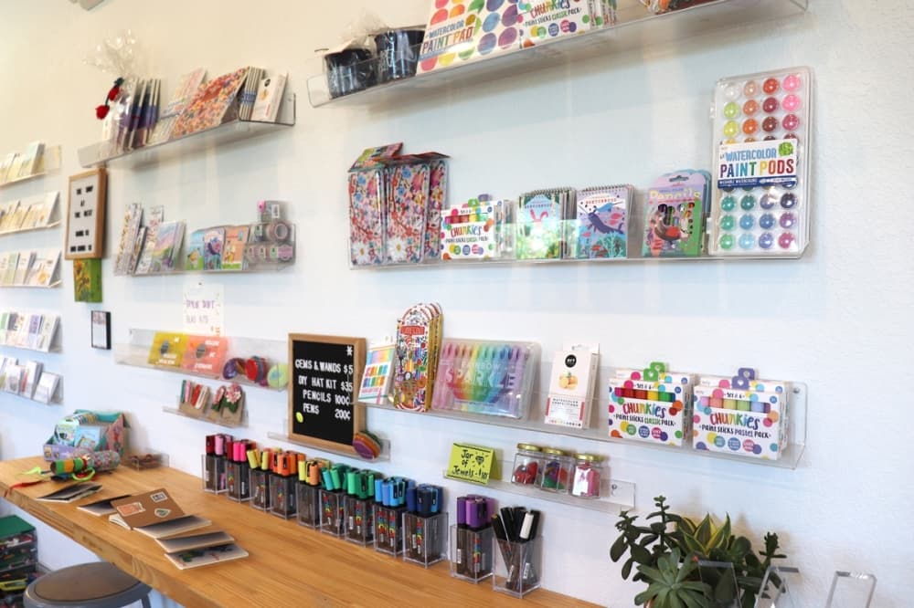 The walls of the main floor are filled with books, stickers and craft supplies. (Zara Flores/Community Impact)
