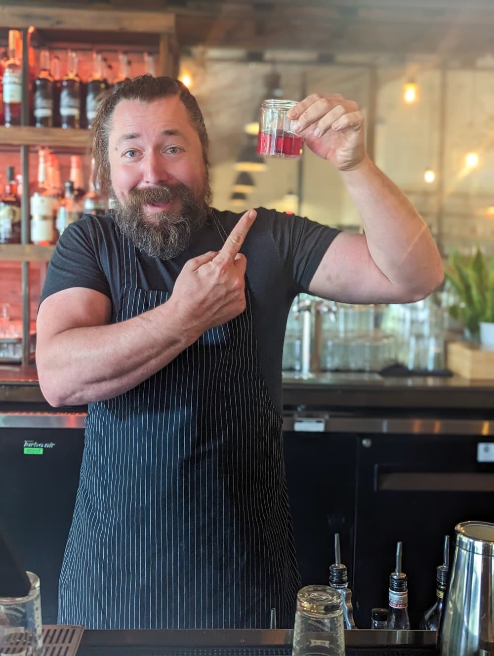 Owner Nic Patrizi makes the restaurant's signature Beetle Juice spirit by grinding up cochineal beetles. (April Kelley/Community Impact)