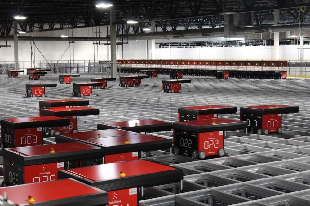 Robots working over a grid in H-E-B e-commerce fulfillment center