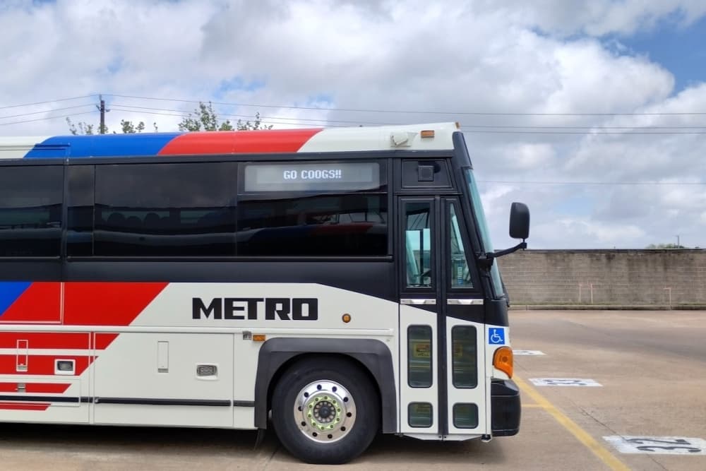 A METRO bus with the sign supporting the University of Houston.