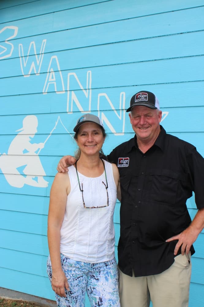 A photo of Joan and Matt Swanson standing outside Swanny's Grill 