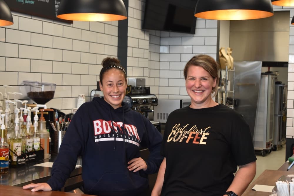 Ashley Ewald (right) owns Kolache Kafe with her husband, Steve (not pictured), while Tristan Washington (left) serves as head barista. (Lizzy Spangler/Community Impact)