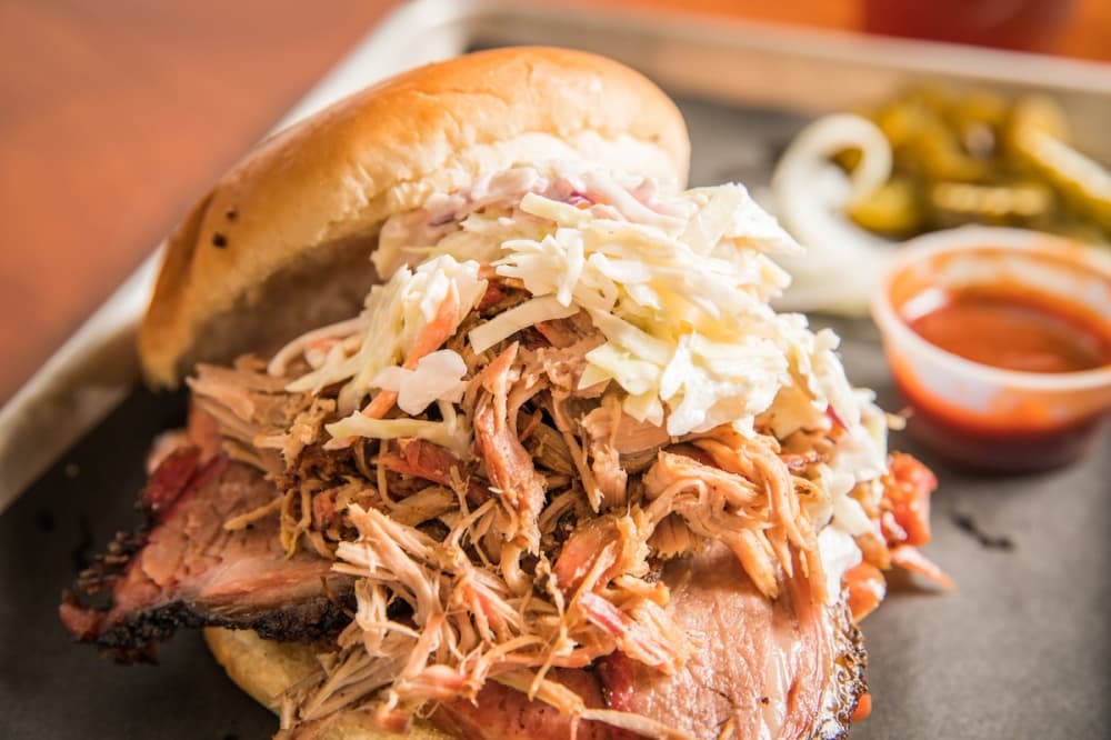 The Weighed is made up of brisket, sausage and pulled pork piled high and topped with slaw ($16). (Courtesy Agape BBQ)