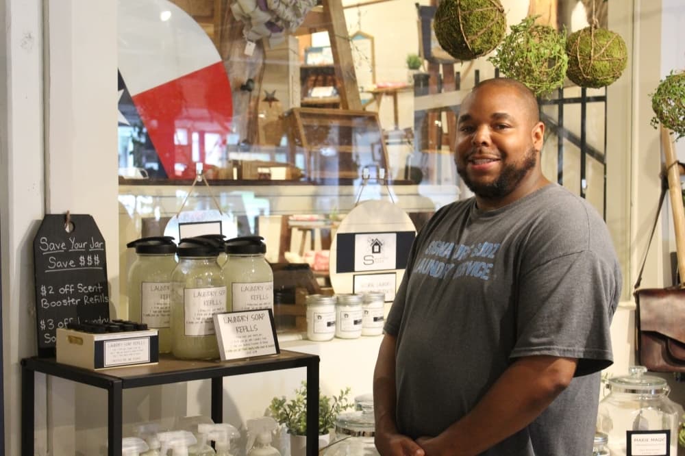 owner standing to his booth