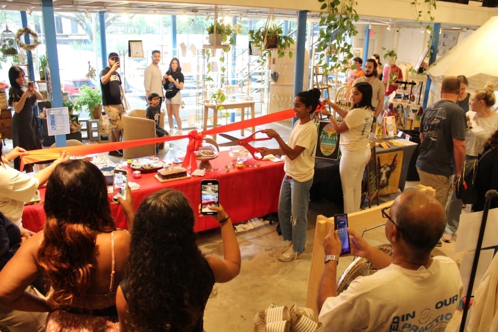 owner doing a ribbon cutting