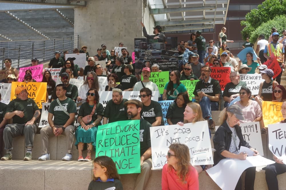 Dozens of city employees gathered June 1 to protest a new in-person work policy going into effect later this year. (Katy McAfee/Community Impact)