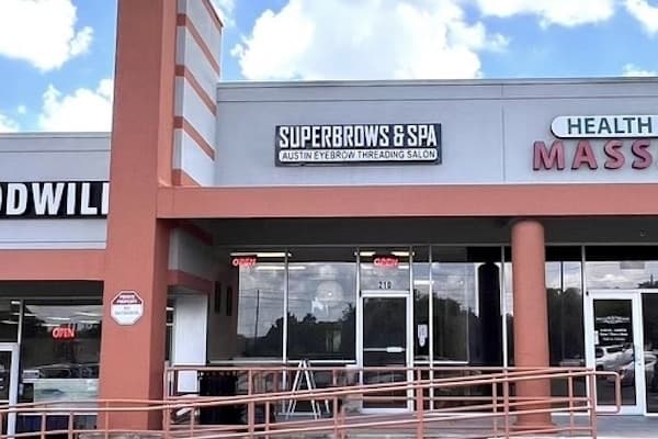 The storefront of a spa in McNeal Crossing shopping center.