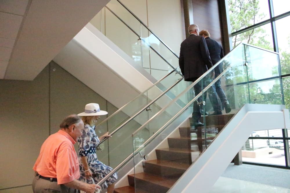 The photo shows a staircase in the George H.W. Bush Community Center