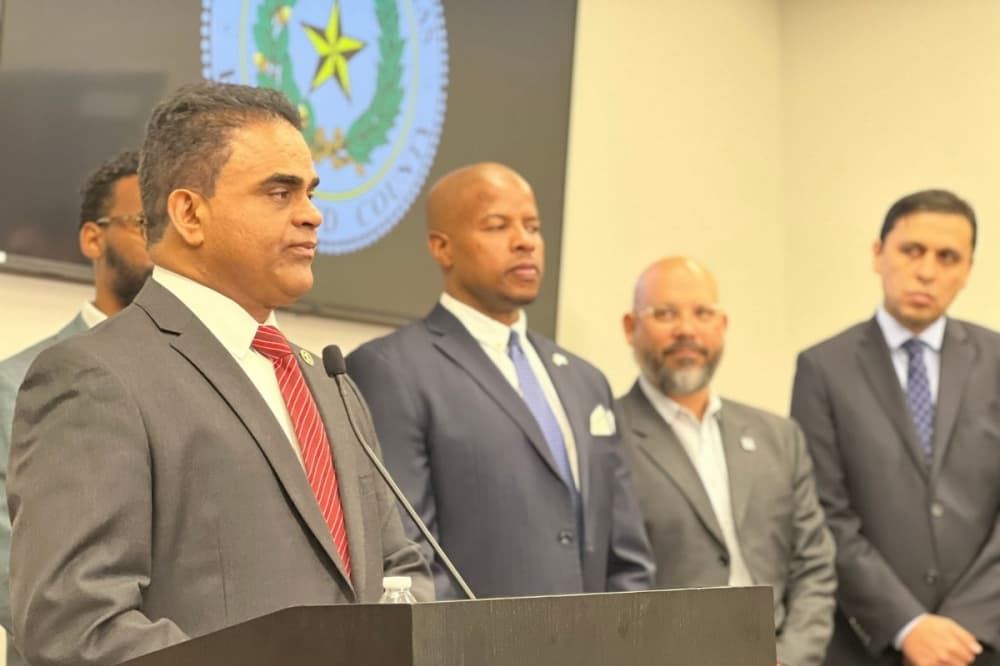KP George speaks to onlookers at press conference held June 14 about affordable housing