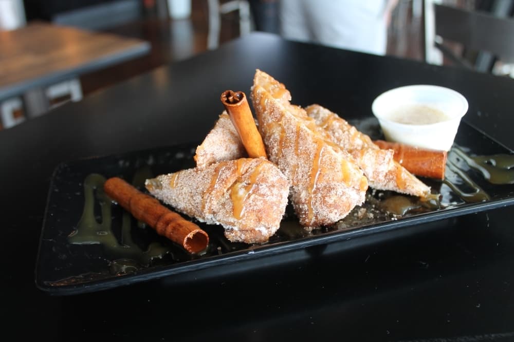 Fried peach cobbler ($7.95) includes peach filling covered in batter that is then fried. (Renee Farmer/Community Impact)